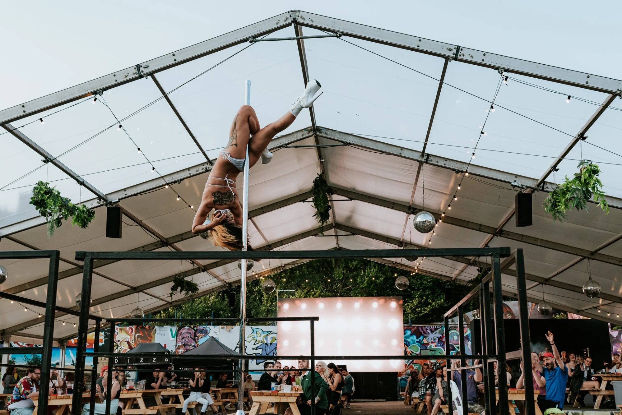 a woman is on the pole.