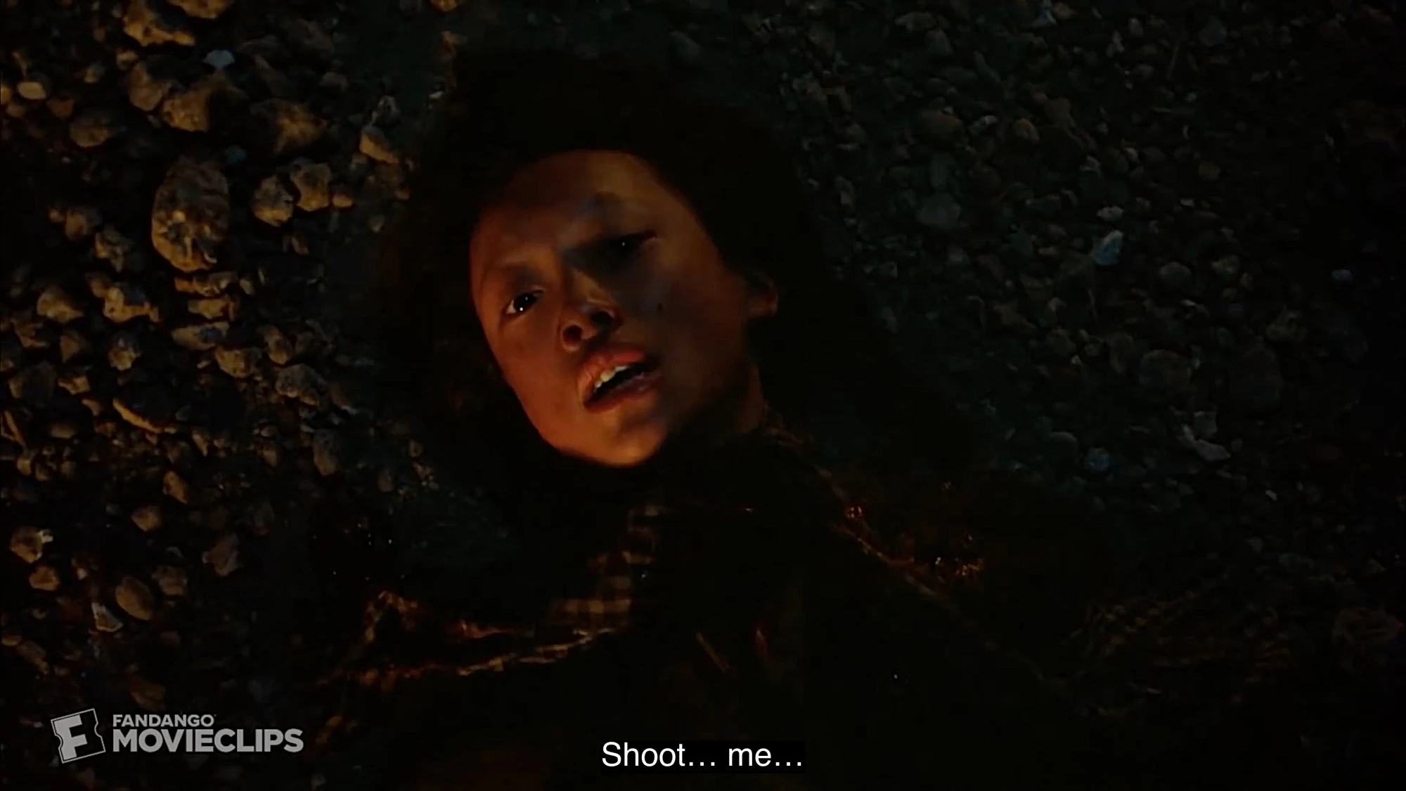 An Asian woman lies on the ground, making intense eye contact with the camera. The caption reads 'Shoot... me...'