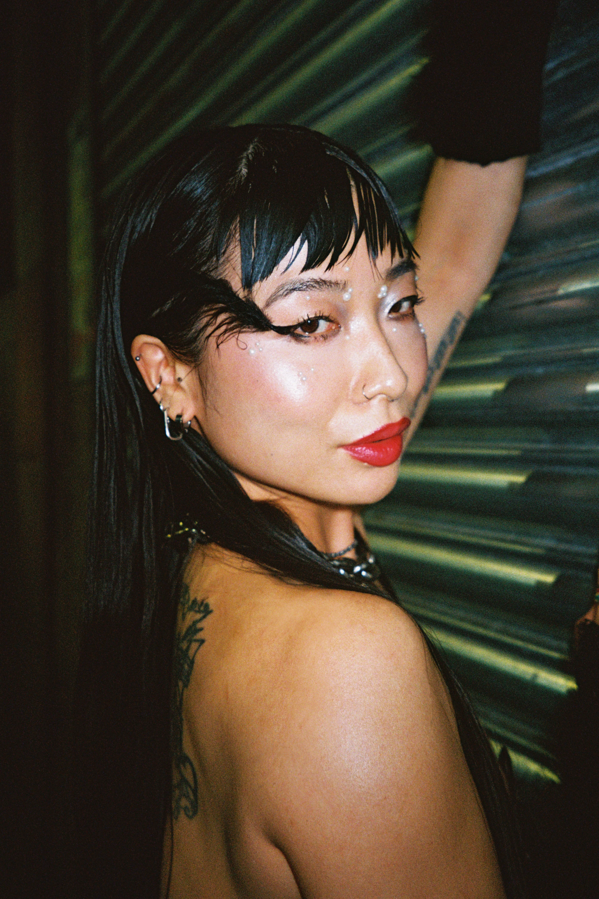 a woman looks at the camera.