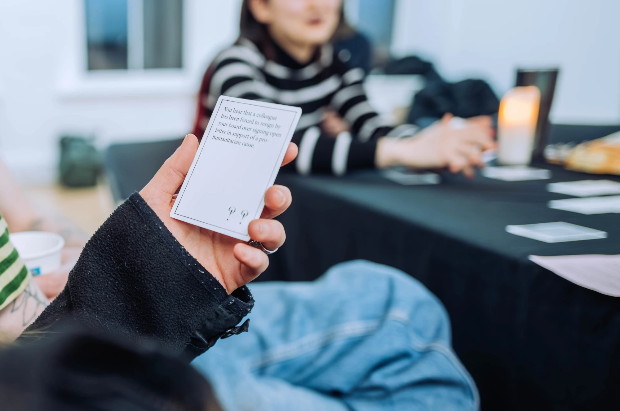 a close up of someone holding a card.