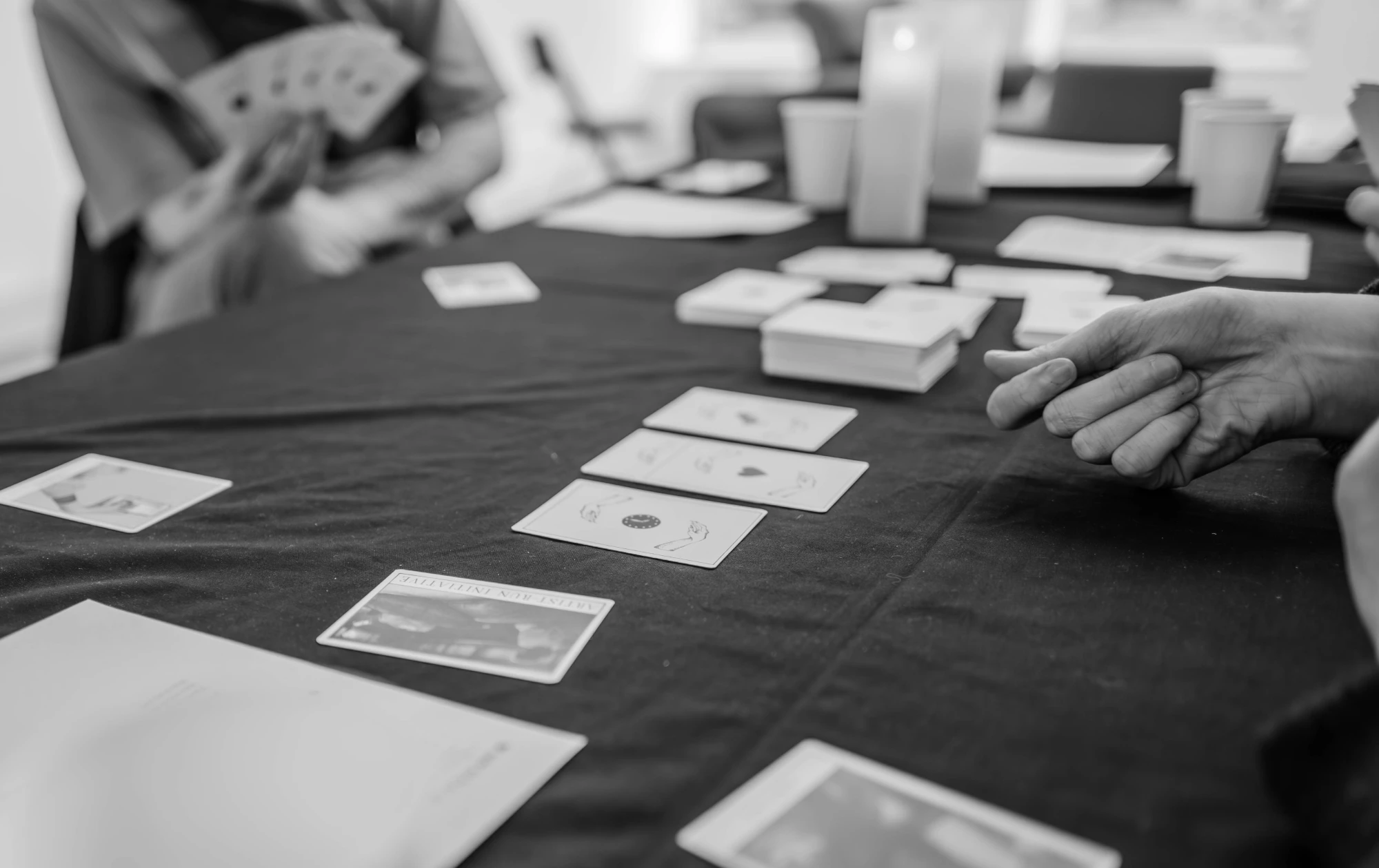 a close up of a card game at a table.